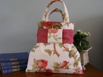 Our French & Floral "Floribunda" handbag is so sweet and made to an extremely high standard. Each bag has a French inner lining, a thick co-ordinating lining and an inside "Floribunda" fabric pocket with our own French & Floral label. Every bag has a detachable bow to the front and is finished off perfectly. Our "Floribunda" hand bag stands on its own - you will not be disappointed! 
MAIN PHOTOGRAPH DISPLAYS REAR OF HANDBAG. Price: &pound;34.66