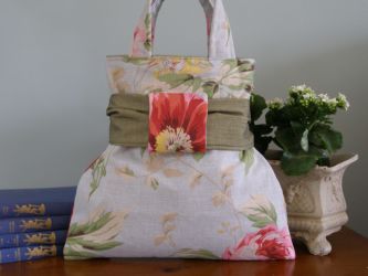 Our French & Floral "Poppy & Peony" hand bag is very sweet and made to an extremely high standard. Each bag has a French inner lining, a thick co-ordinating lining and an inside "Peony" fabric pocket with our own French & Floral label. Every bag has a detachable bow to the front and is finished off perfectly. Our "Poppy & Peony" hand bag stands on its own - you will not be disappointed!
MAIN PHOTOGRAPH DISPLAYS REAR OF HANDBAG 
 Price: &pound;34.66