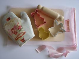 Our "Raphi" baking set is wonderful for those little hands that love to bake. Each "Raphi" baking set comprises of three hand chosen pastel pastry cutters ( white angel/pink floppy rabbit/yellow duckling), a "Raphi" baking glove and a mini beech rolling pin tied together in our own French and Floral bag. A wonderful gift for that special little girl! 
 Price: &pound;22.33